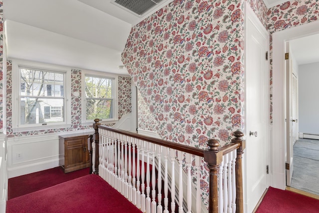 14 Highland St, Portland, ME 04103 - bedroom with wallpapered walls, a baseboard heating unit, and carpet floors