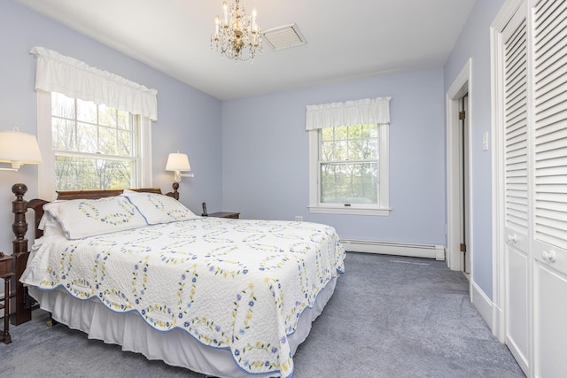 14 Highland St, Portland, ME 04103 - carpeted bedroom featuring baseboard heating, multiple windows, a chandelier, and a closet