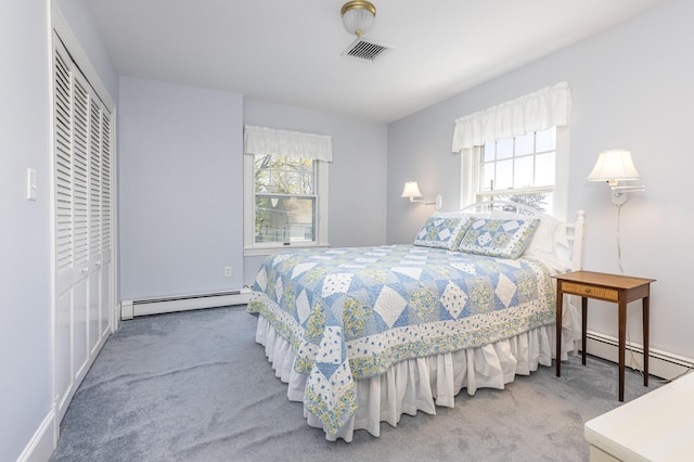 14 Highland St, Portland, ME 04103 - carpeted bedroom with a baseboard radiator, multiple windows, and baseboards