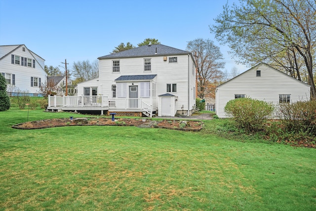 51 Googin St, Lewiston, ME 04240 - back of house with a wooden deck and a lawn