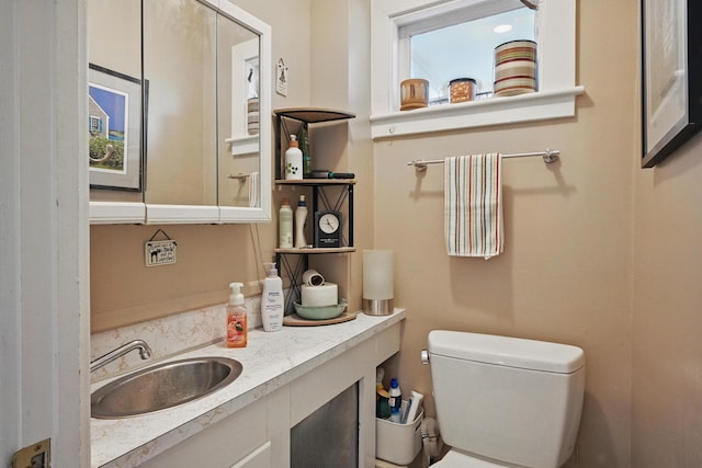 51 Googin St, Lewiston, ME 04240 - half bathroom featuring toilet and vanity
