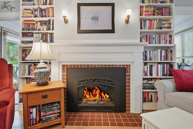 51 Googin St, Lewiston, ME 04240 - sitting room featuring a brick fireplace, healthy amount of natural light, and built in features