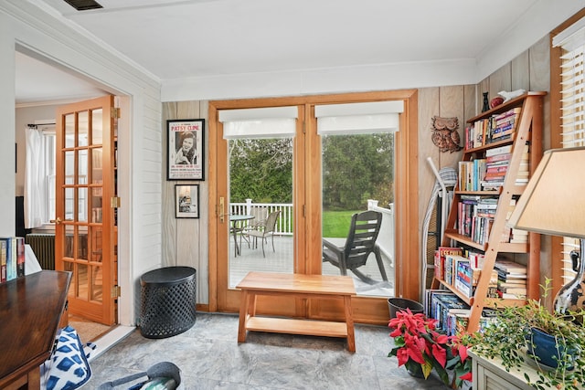 51 Googin St, Lewiston, ME 04240 - doorway to outside featuring ornamental molding and wooden walls