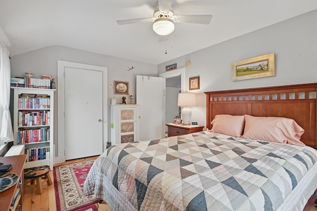 51 Googin St, Lewiston, ME 04240 - bedroom featuring wood finished floors, vaulted ceiling, and a ceiling fan