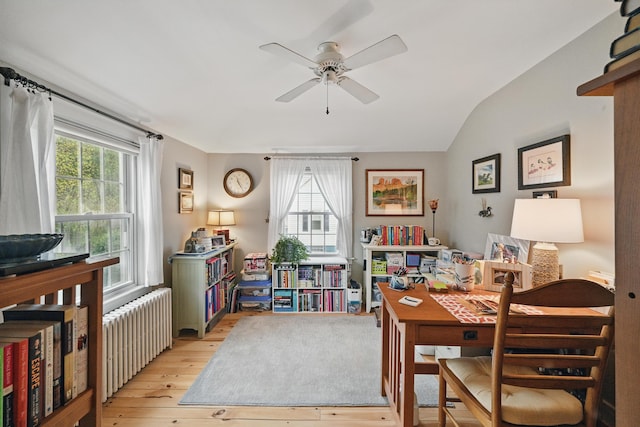 51 Googin St, Lewiston, ME 04240 - dining area featuring radiator, light wood finished floors, a ceiling fan, and vaulted ceiling