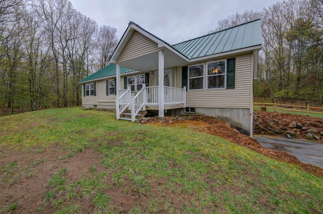229 Stone Rd, Newfield, ME 04095 - view of front facade with a front lawn, metal roof, and a standing seam roof