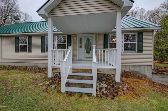 229 Stone Rd, Newfield, ME 04095 - doorway to property featuring metal roof and a standing seam roof