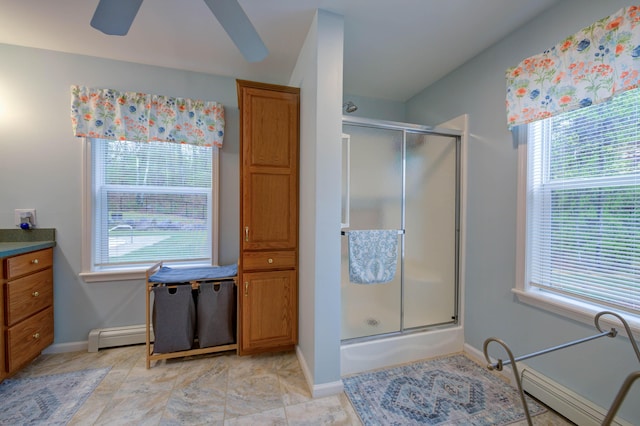 229 Stone Rd, Newfield, ME 04095 - full bathroom featuring plenty of natural light, baseboards, a baseboard heating unit, and ceiling fan