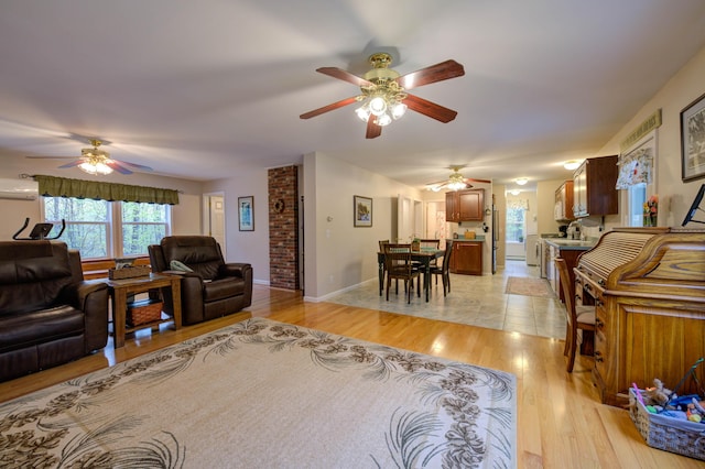 229 Stone Rd, Newfield, ME 04095 - living room featuring ceiling fan, a wall unit AC, light wood finished floors, and baseboards