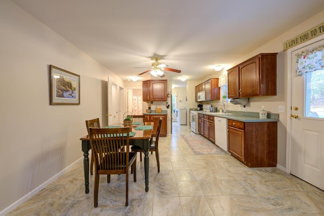 229 Stone Rd, Newfield, ME 04095 - kitchen featuring white appliances, a ceiling fan, baseboards, and brown cabinets