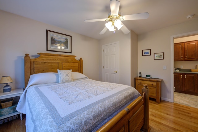 229 Stone Rd, Newfield, ME 04095 - bedroom with light wood-style flooring, a ceiling fan, and baseboards