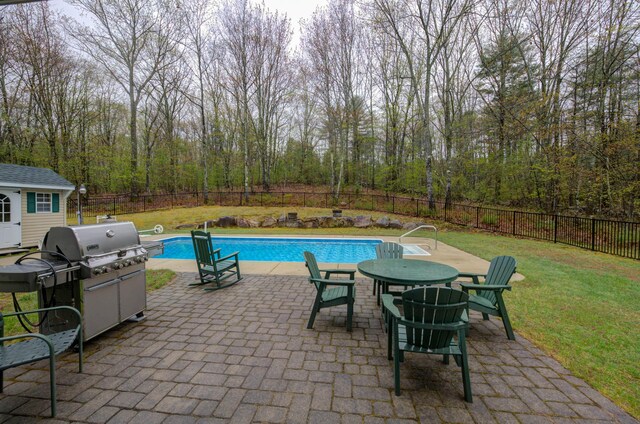 229 Stone Rd, Newfield, ME 04095 - view of swimming pool featuring area for grilling, a patio, an outbuilding, and a forest view