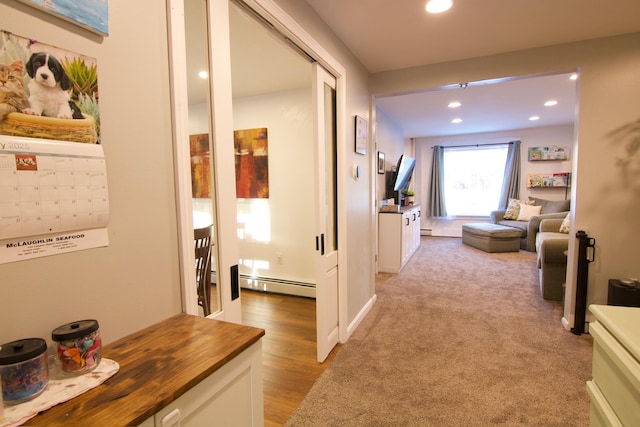 14 Fields Pond Rd, Holden, ME 04429 - hallway featuring a baseboard radiator, light wood finished floors, and recessed lighting