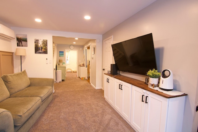 14 Fields Pond Rd, Holden, ME 04429 - living room with light carpet, a wall mounted air conditioner, and recessed lighting