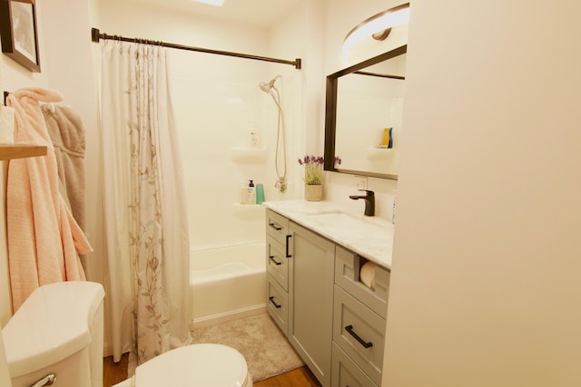14 Fields Pond Rd, Holden, ME 04429 - bathroom featuring vanity, toilet, shower / bathtub combination with curtain, and wood finished floors