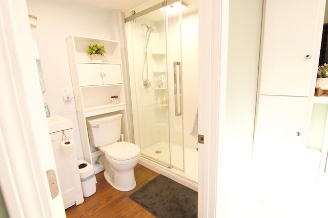 14 Fields Pond Rd, Holden, ME 04429 - bathroom featuring a stall shower, vanity, toilet, and wood finished floors