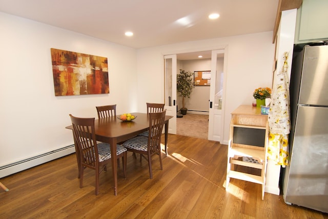 14 Fields Pond Rd, Holden, ME 04429 - dining room with wood finished floors, a baseboard radiator, and recessed lighting