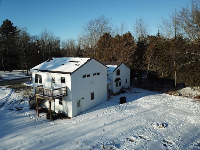 14 Fields Pond Rd, Holden, ME 04429 - snow covered rear of property with a wooden deck