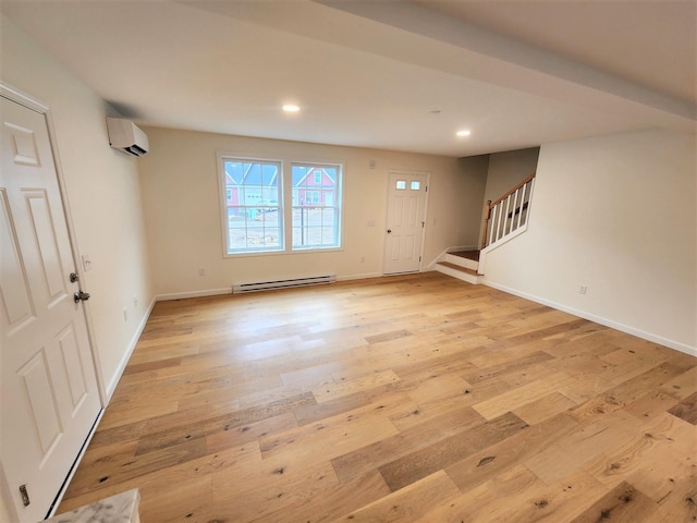 entryway with light wood finished floors, stairway, baseboards, baseboard heating, and recessed lighting