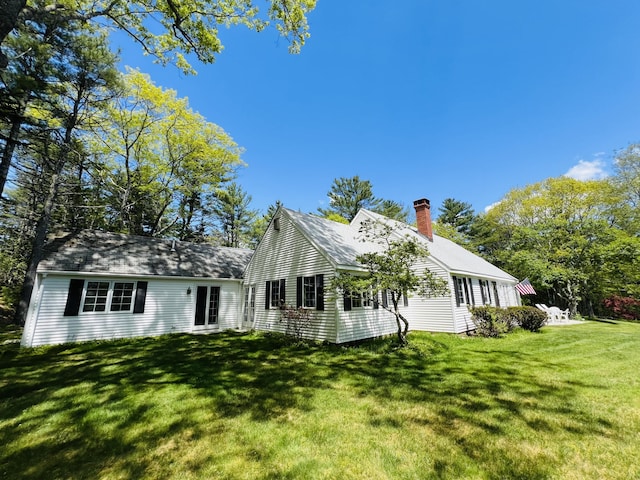 329 Salt Pond Rd, Blue Hill, ME 04614 - view of front of property with a chimney and a front lawn