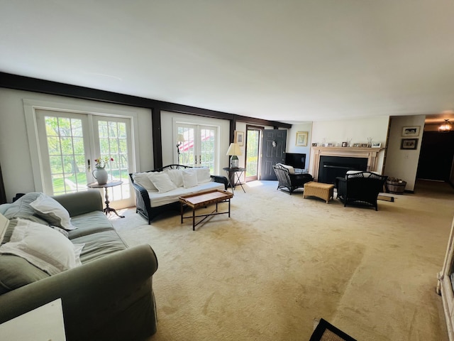 329 Salt Pond Rd, Blue Hill, ME 04614 - living room with french doors, light colored carpet, and a fireplace