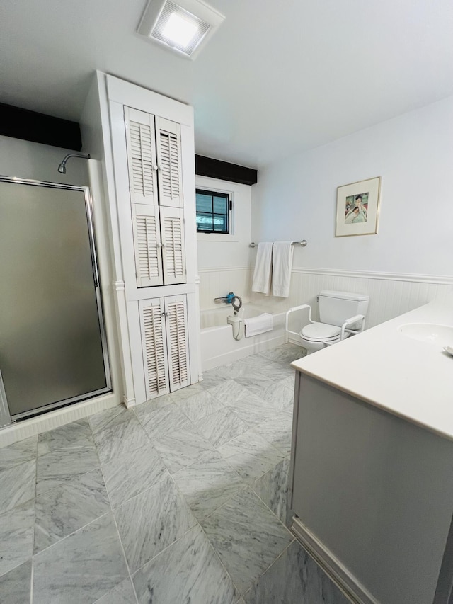 329 Salt Pond Rd, Blue Hill, ME 04614 - full bath featuring vanity, a bath, a shower stall, toilet, and a wainscoted wall