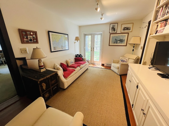 329 Salt Pond Rd, Blue Hill, ME 04614 - living area with track lighting, a baseboard radiator, and french doors