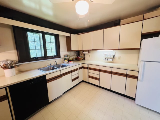 329 Salt Pond Rd, Blue Hill, ME 04614 - kitchen with freestanding refrigerator, a sink, black dishwasher, and light countertops