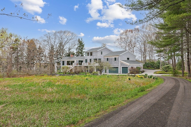 388 High Head Rd, Harpswell, ME 04079 - view of front facade with a chimney, a deck, and a front yard