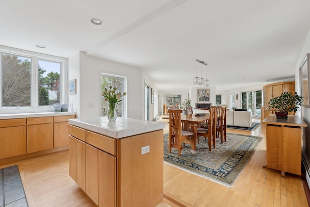 388 High Head Rd, Harpswell, ME 04079 - kitchen featuring tile counters, light wood-style floors, pendant lighting, recessed lighting, and a kitchen island