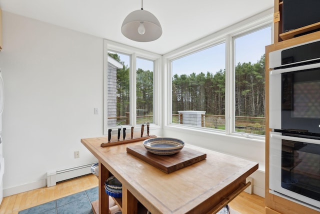 388 High Head Rd, Harpswell, ME 04079 - dining space featuring a baseboard heating unit, plenty of natural light, and light wood finished floors