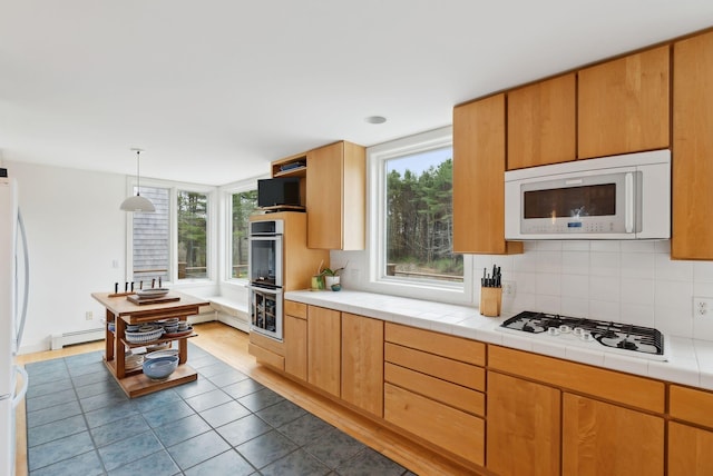 388 High Head Rd, Harpswell, ME 04079 - kitchen with white appliances, a baseboard heating unit, dark tile patterned flooring, and backsplash
