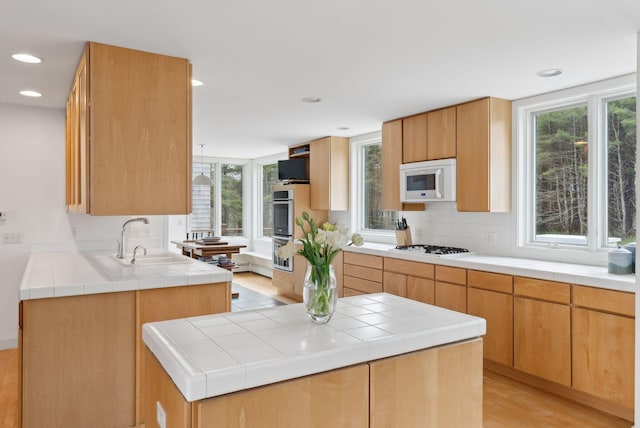 388 High Head Rd, Harpswell, ME 04079 - kitchen featuring a sink, white appliances, backsplash, light wood-type flooring, and recessed lighting