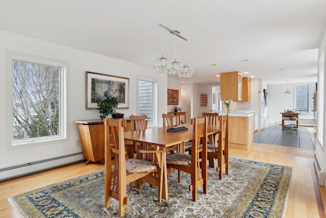 388 High Head Rd, Harpswell, ME 04079 - dining room featuring a baseboard heating unit, light wood-style floors, recessed lighting, and a chandelier