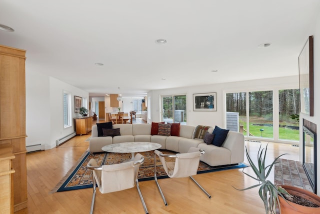 388 High Head Rd, Harpswell, ME 04079 - living room with a baseboard radiator and light wood-type flooring