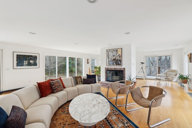388 High Head Rd, Harpswell, ME 04079 - living room featuring plenty of natural light, a brick fireplace, wood finished floors, and recessed lighting