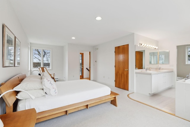 388 High Head Rd, Harpswell, ME 04079 - bedroom featuring connected bathroom, light colored carpet, recessed lighting, and a sink