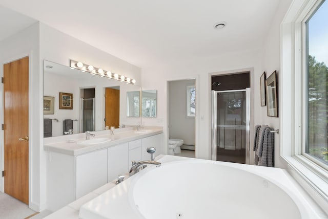 388 High Head Rd, Harpswell, ME 04079 - full bathroom with toilet, a stall shower, plenty of natural light, and baseboard heating