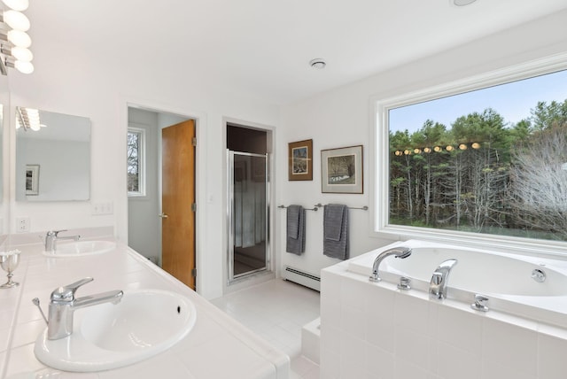 388 High Head Rd, Harpswell, ME 04079 - full bathroom with a baseboard heating unit, a bath, a shower stall, double vanity, and tile patterned flooring