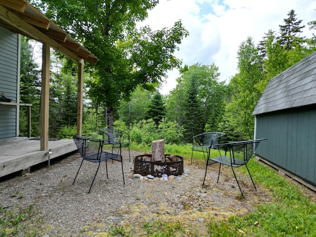 1352 Main Rd, Carroll Plt, ME 04487 - view of yard with a deck and an outdoor fire pit