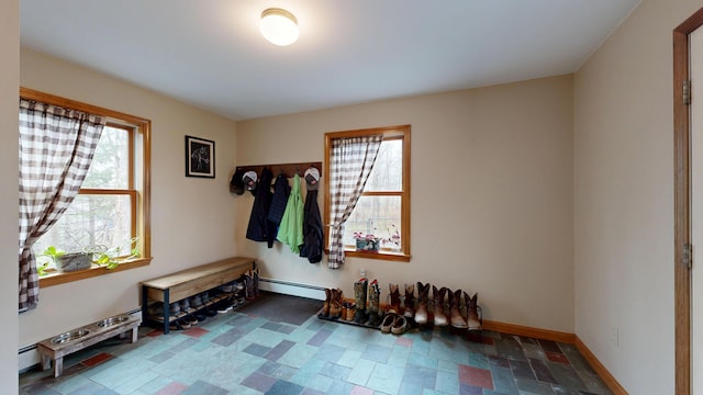 mudroom with plenty of natural light, a baseboard radiator, and baseboards