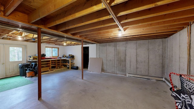 below grade area featuring baseboard heating