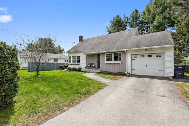 ranch-style house featuring a garage, a chimney, and driveway