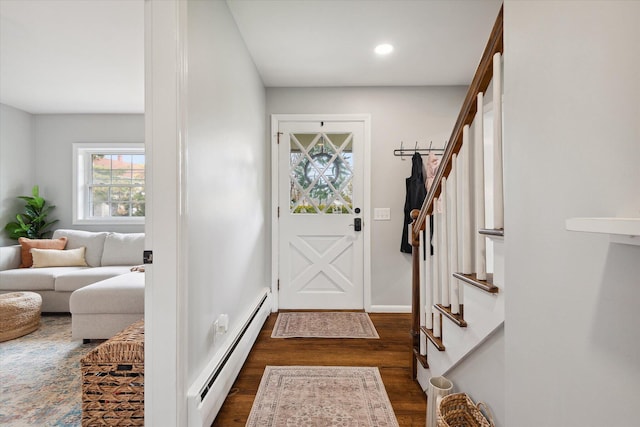foyer featuring a baseboard heating unit, dark wood finished floors, stairway, recessed lighting, and baseboards
