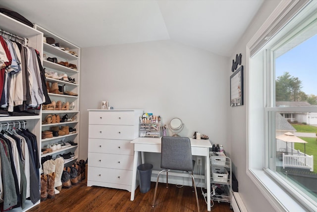 home office with vaulted ceiling and dark wood-style flooring