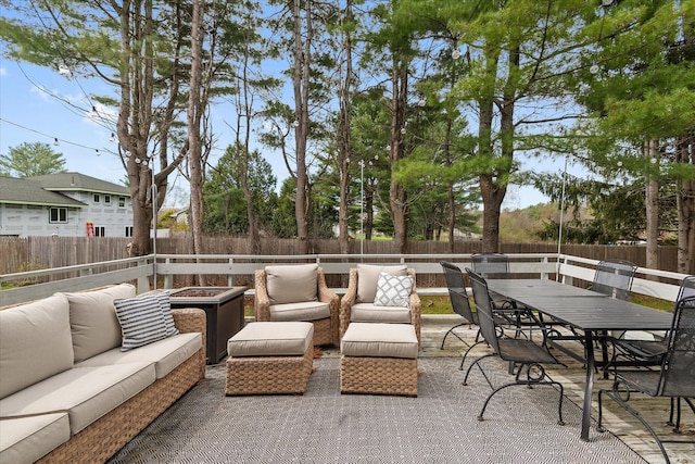 view of patio / terrace with an outdoor hangout area, a fenced backyard, and outdoor dining space