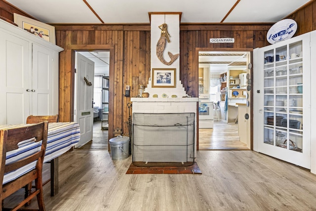 interior space featuring wooden walls and wood finished floors