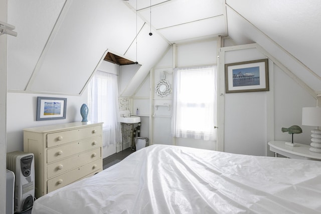 bedroom featuring vaulted ceiling