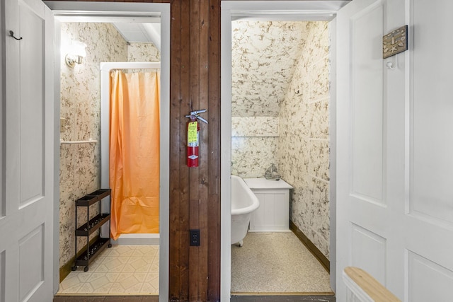 full bath with a freestanding bath and a shower