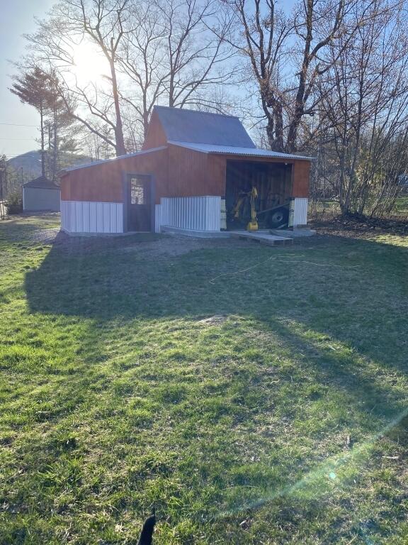 view of outbuilding featuring an outdoor structure
